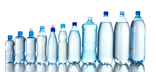 Group plastic bottles of water isolated on white